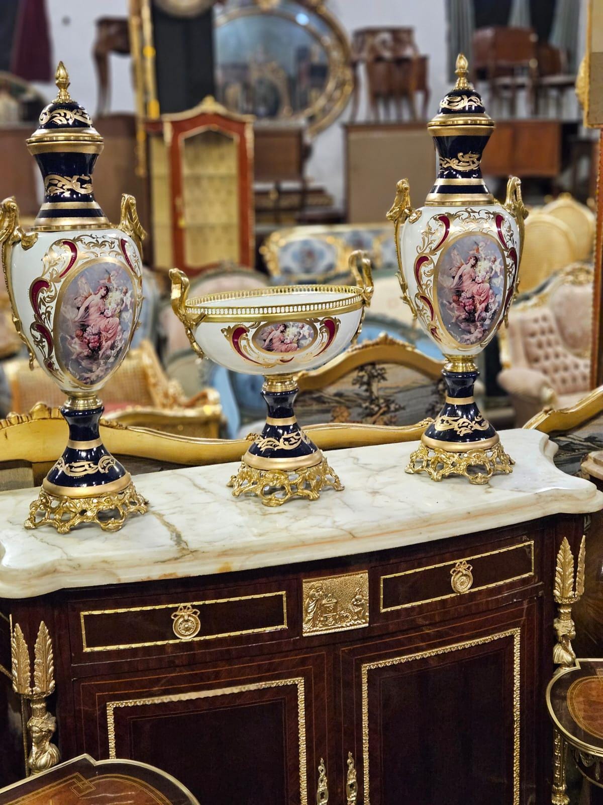 Pair of Large Hand-Painted Porcelain Urns with Gilt Bronze Bases – French Rococo Style